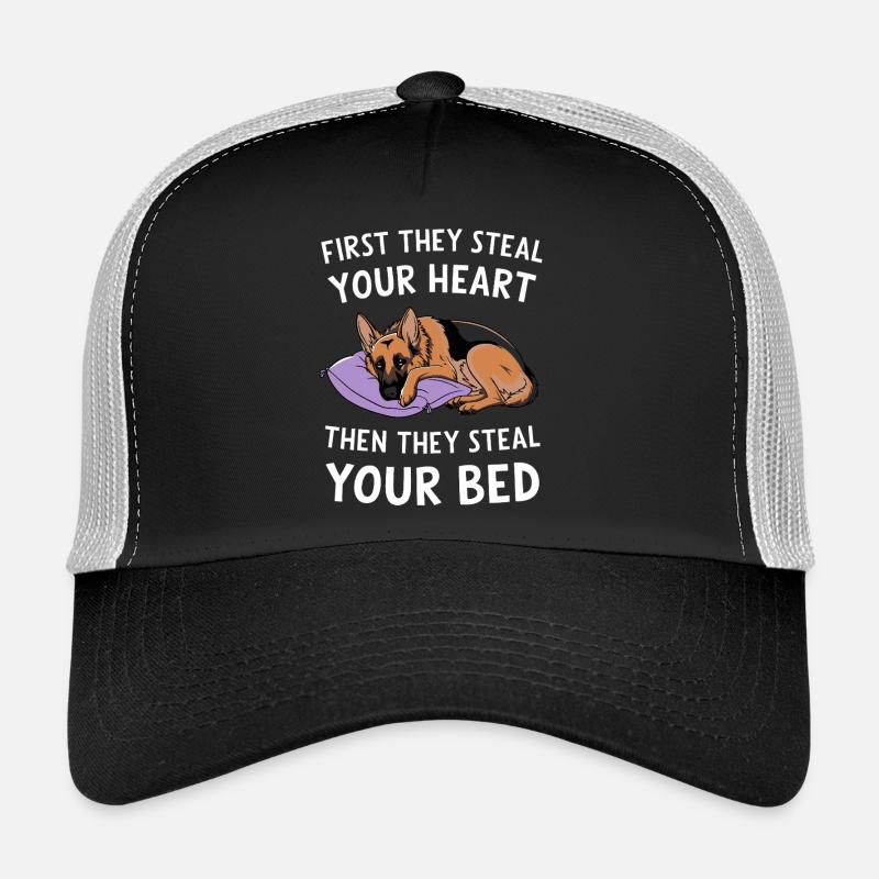 German Shepherd Steals Heart and Bed Trucker Cap