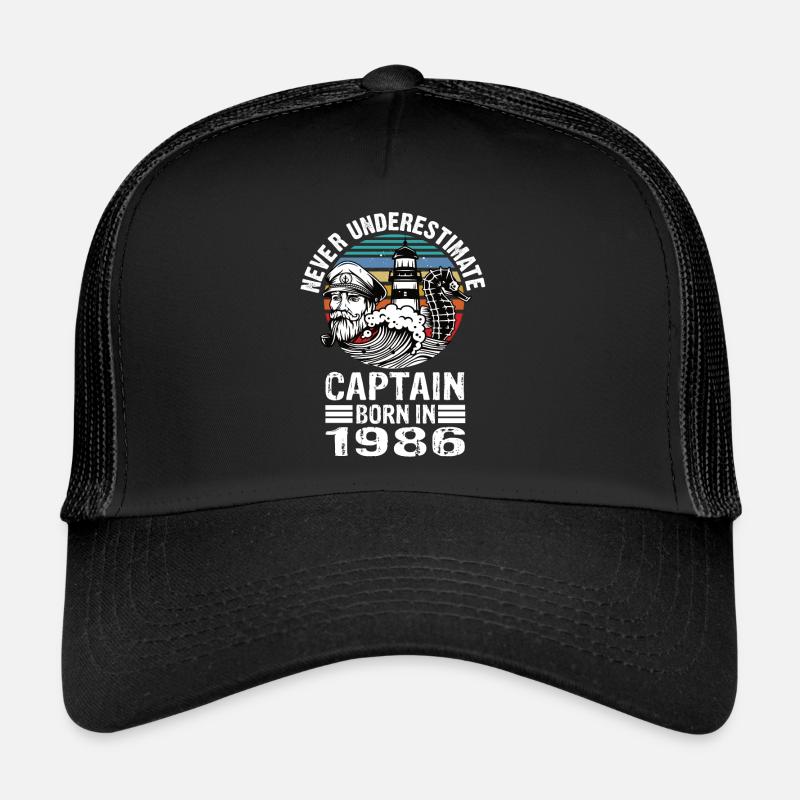 Never Underestimate Captain born in 1986 Trucker Cap