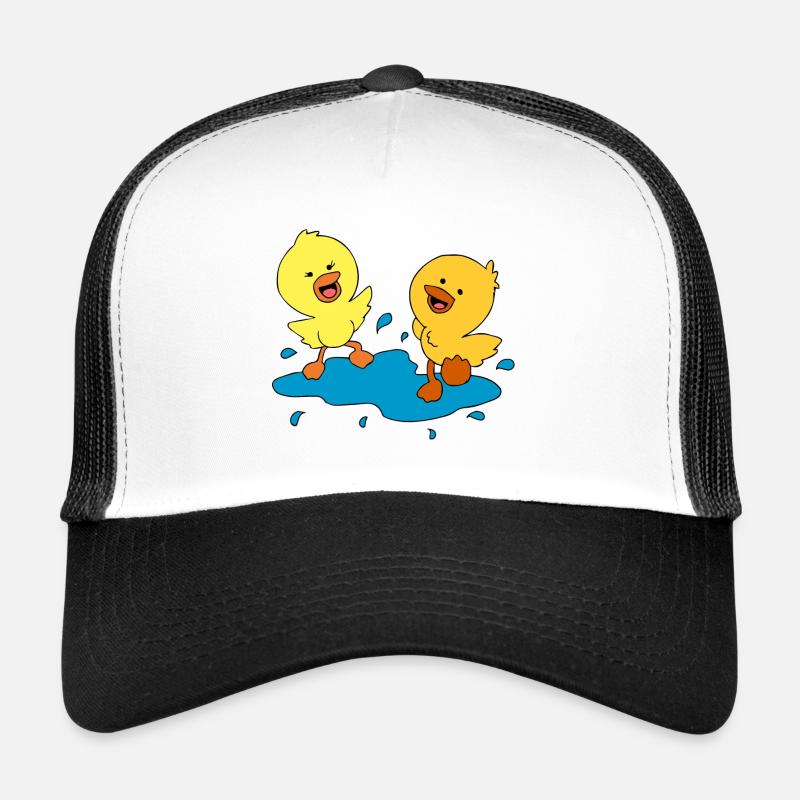 Cute ducklings splashing in a puddle Trucker Cap