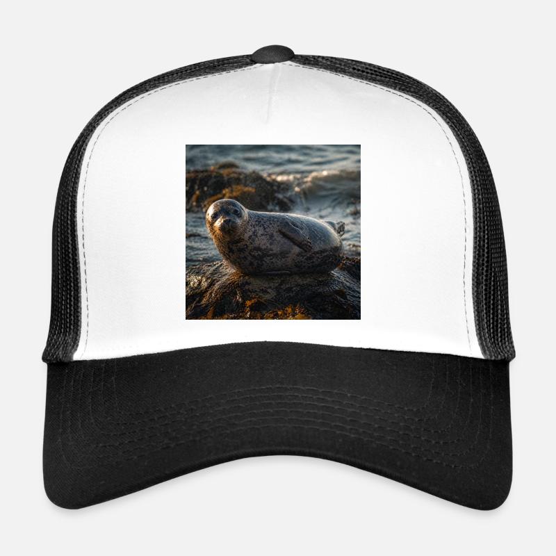 Seal on cliff by the sea Trucker Cap