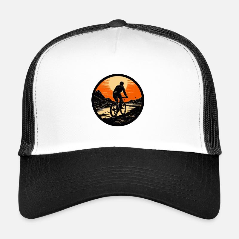 Mountain biking at sunset Trucker Cap