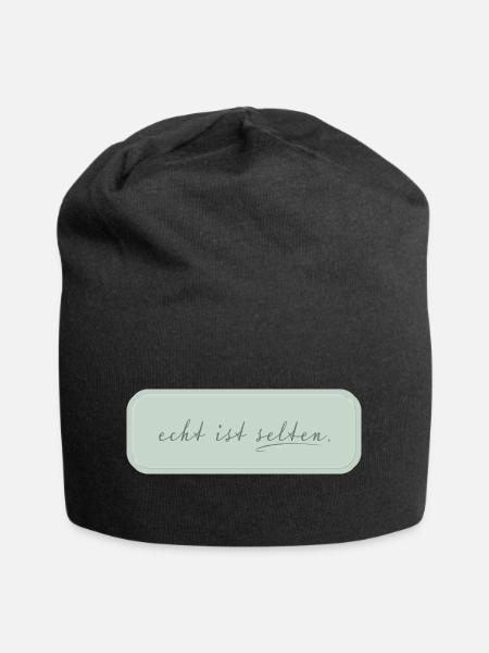 echt ist selten – minimalistische Typografie - Jersey-Beanie - Schwarz