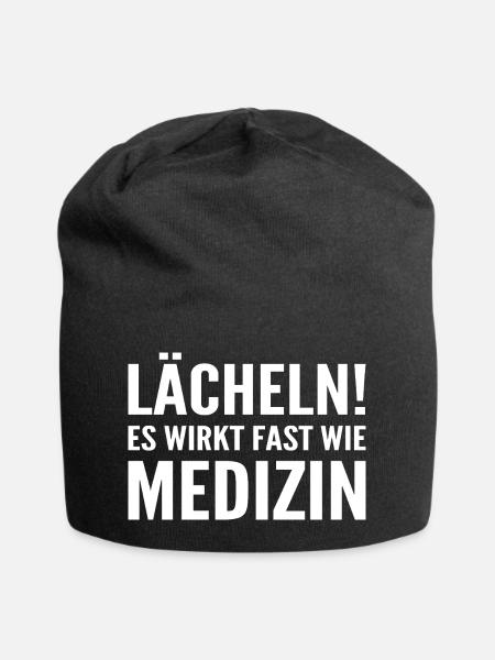 Lächeln! Es wirkt fast wie Medizin - Jersey-Beanie - Schwarz