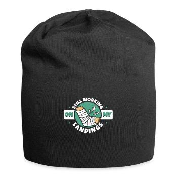 Ich arbeite immer noch an meinen Landungen, gebrochener Fingerknochen - Jersey-Beanie - Schwarz - Vorne