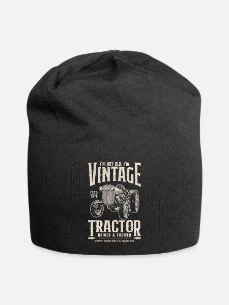 De uitstekende Verjaardag van de Landbouwer van de Tractor die in 1975 wordt geboren - Jersey-Beanie - zwart