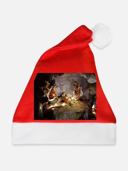Illuminierte Krippe zwischen Steinen - Weihnachtsmütze - Rot