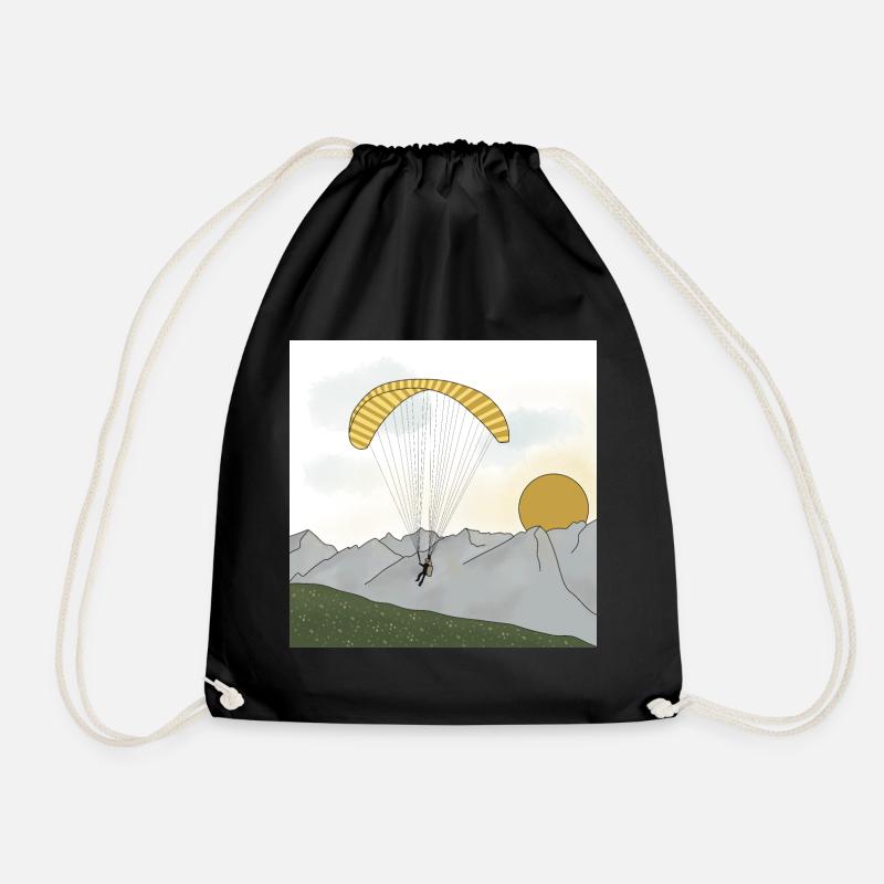 Paraglider sailing in the mountains sunset - Drawstring Bag - black