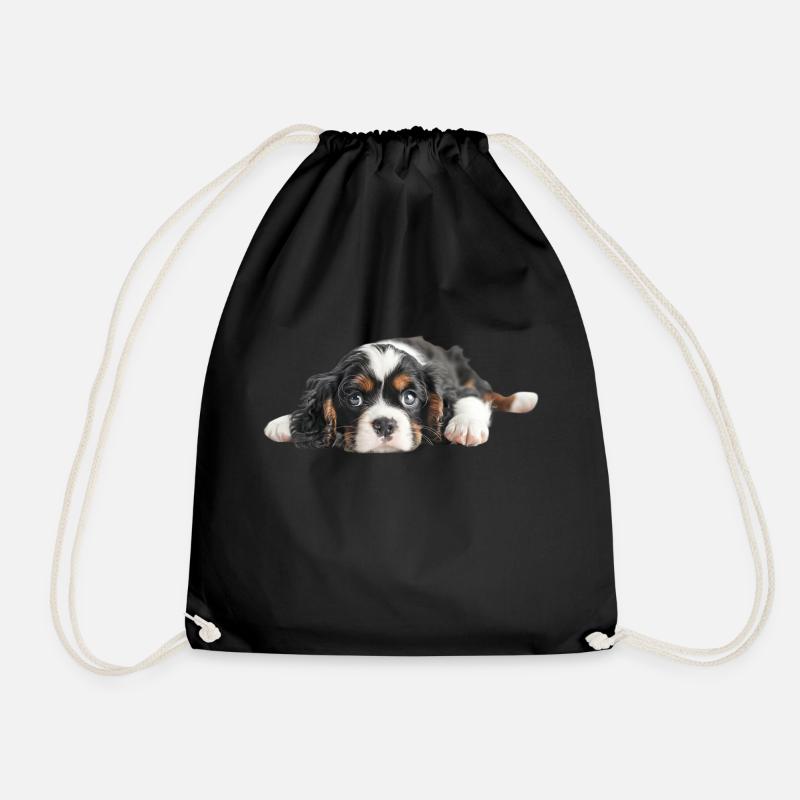 Adorable puppy lying down with expressive blue eye - Drawstring Bag - black