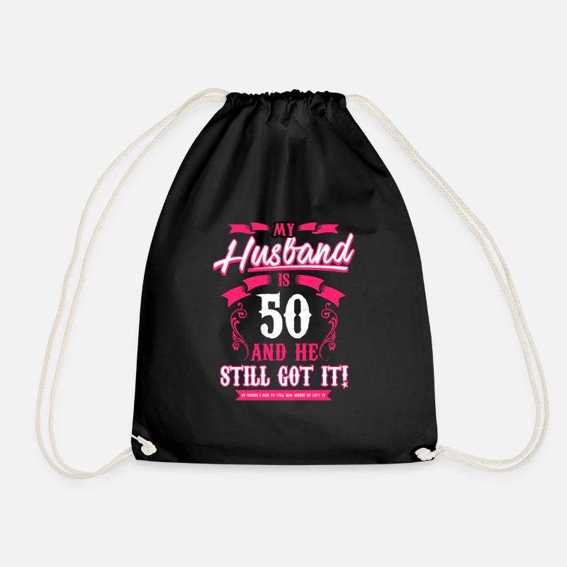 My Husband is 50 T Shirt and he still got it funny - Drawstring Bag - black