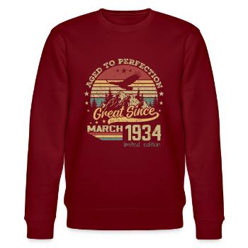 90 years old Aged to Perfection born in March 1934 - Stanley/Stella CHANGER Unisex Organic Sweatshirt - burgundy - Front - Nik (191cm) & Marisol (170cm)