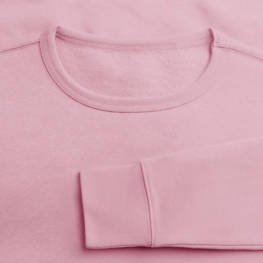Pisa badge on a stanley/stella roller unisex organic sweatshirt, cotton pink, close-up