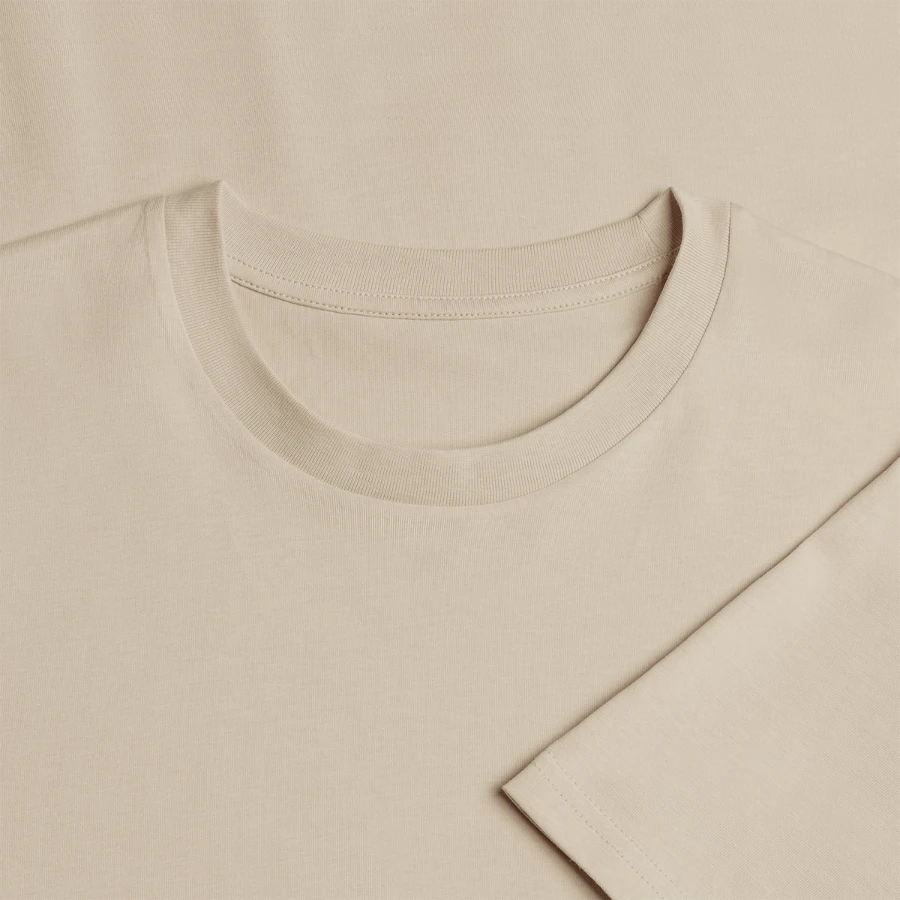 Grindelwald badge on a stanley/stella creator unisex organic t-shirt, beige, neck label