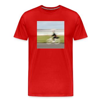 Woman cyclist in motion on a straight asphalt road - Men's Premium Organic T-Shirt - red - Front - Damien (186cm)