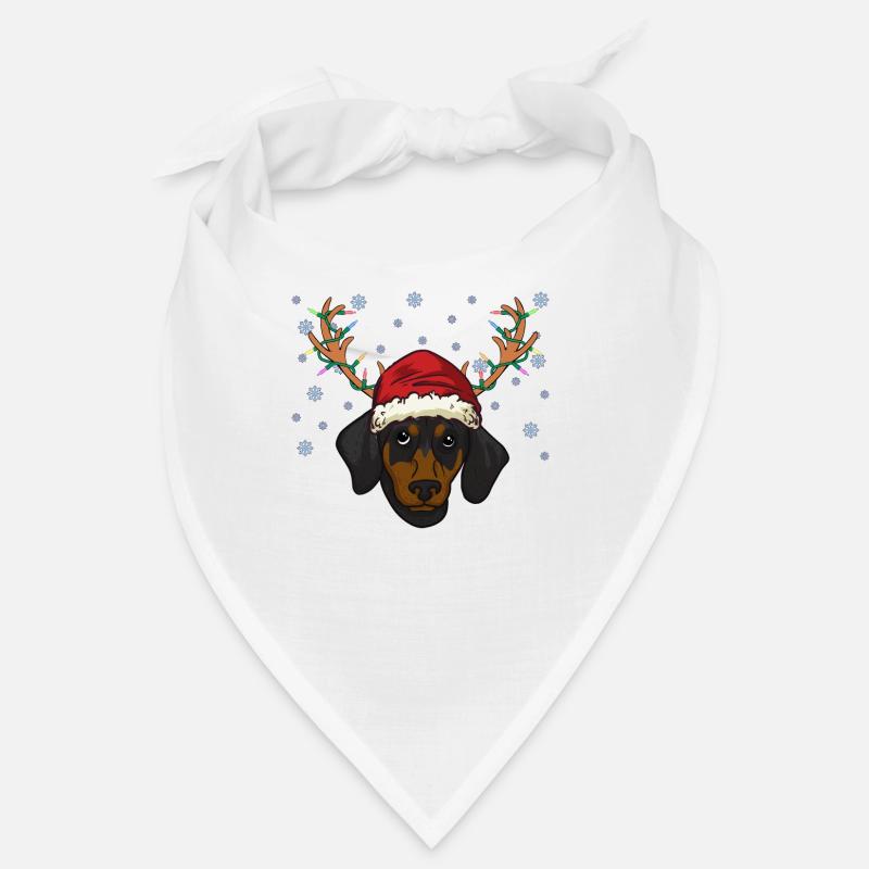 Chiot teckel avec bonnet de Noel et bois Bandana