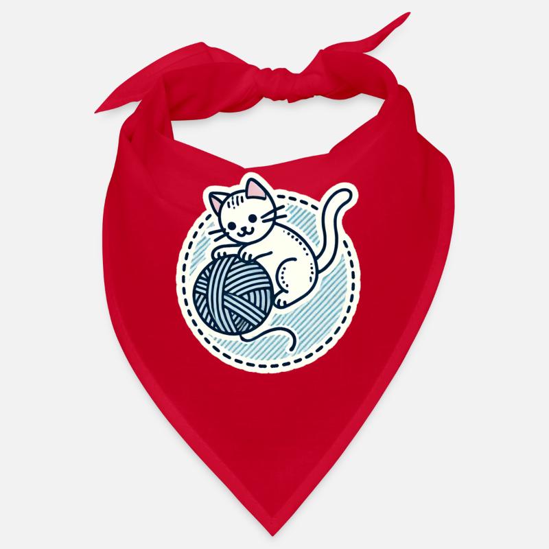 Süßes weißes Kätzchen, das mit einem Garn spielt Bandana