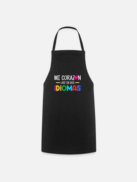Mi corazon late en dos idiomas, bilingual Spanish - Cooking Apron - black