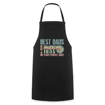 The best fathers were born in 1935, 88 years old, - Cooking Apron - black - Front - AI Model Male 185 dark (185cm)