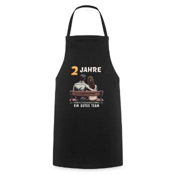 2 YEARS A GOOD TEAM MAN WOMAN - Cooking Apron - black - Front - AI Model Male 185 dark (185cm)