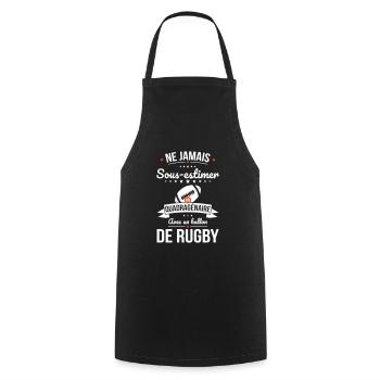 Sous-estimer un quadragénaire avec ballon de rugby - Tablier de cuisine - noir - Devant - AI Model Male 185 dark (185cm)