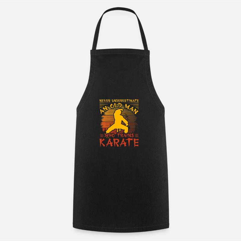 Never underestimate an old man who trains karate - Cooking Apron - black