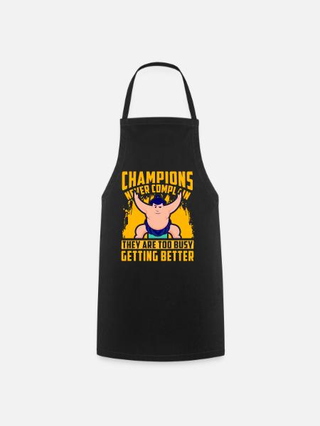 Champions never complain they are too busy getting - Cooking Apron - black