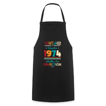 50 Years Anniversary - Vintage - December 1974 - Cooking Apron - black - Front - AI Model Male 185 dark (185cm)