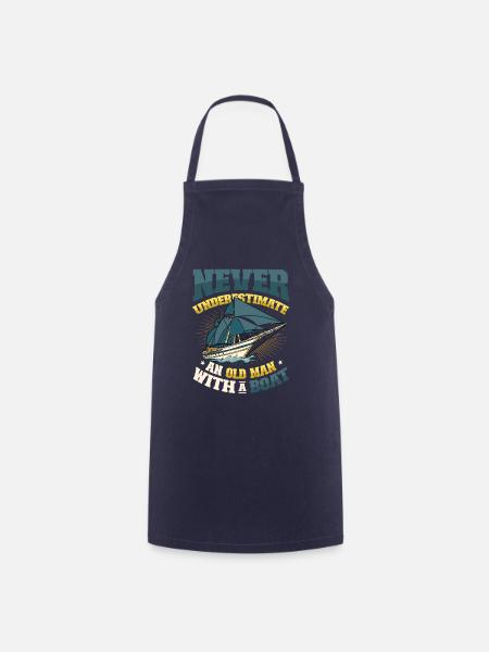 Never underestimate an old man with a boat - Cooking Apron - navy