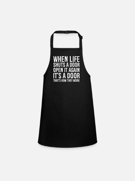 when life shuts a door funny shirt - Children's Apron - black - Front