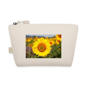 Sunflower flower head protrudes from a field - Organic Pouch - nature - Front