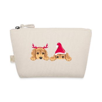 Chiots retriever jetant un coup d’œil dans des accessoires de Noël - Trousse biologique - nature - Devant