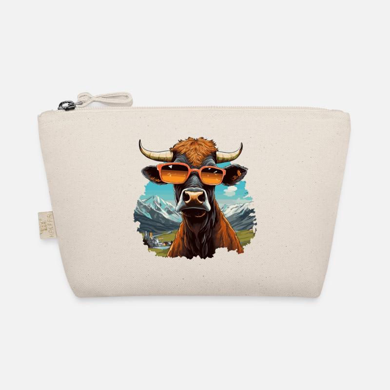 Vache cool en lunettes de soleil dans un paysage de montagne Trousse biologique