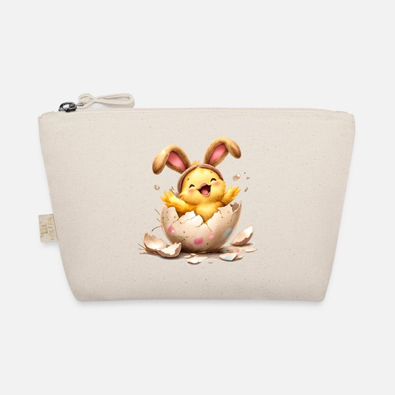 Poussin aux oreilles de lapin dans un œuf de Pâques Trousse biologique