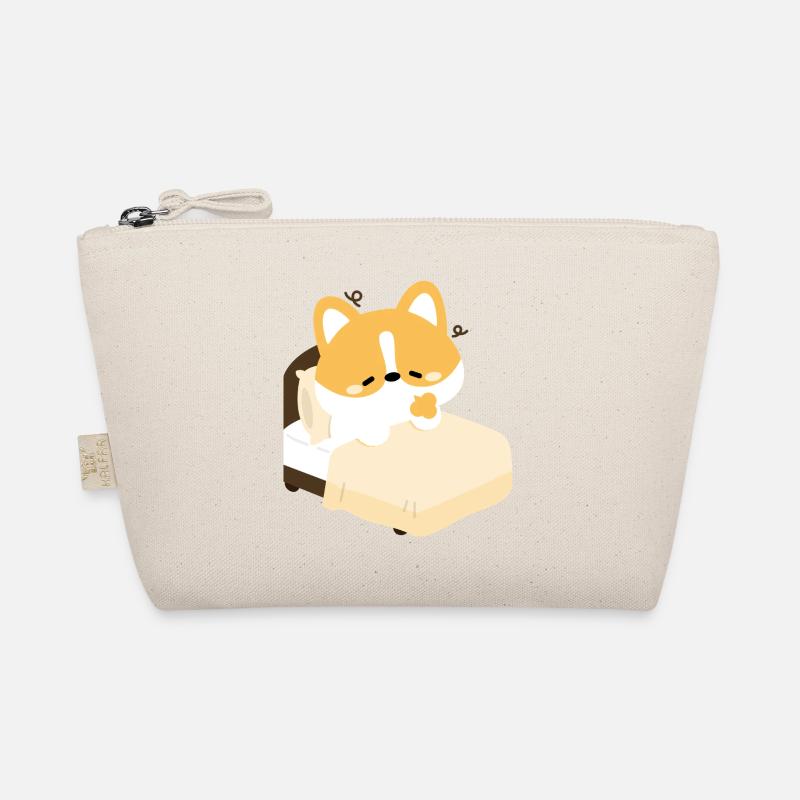 Corgi fatigué sur le lit Trousse biologique