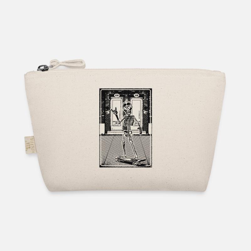 Squelette avec skateboard devant la maçonnerie de briques Trousse biologique