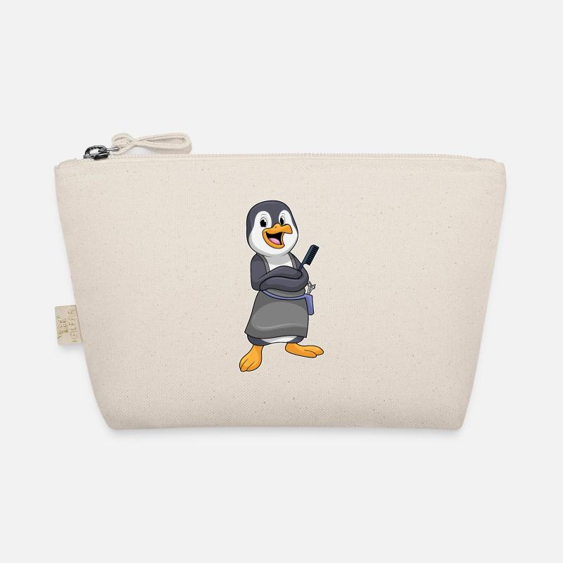 Pingouin comme coiffeur avec un peigne Trousse biologique