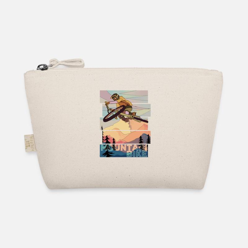 Retro MountainBiker springt mit MTB über Table vor Bio-Täschchen