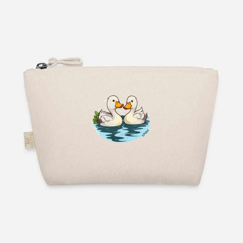 Deux adorables petits canards dans l’étang Trousse biologique