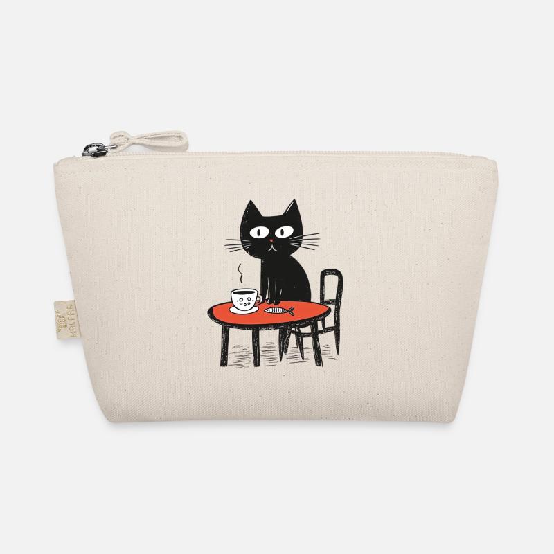 Chat naïf avec du café et du poisson à table Trousse biologique