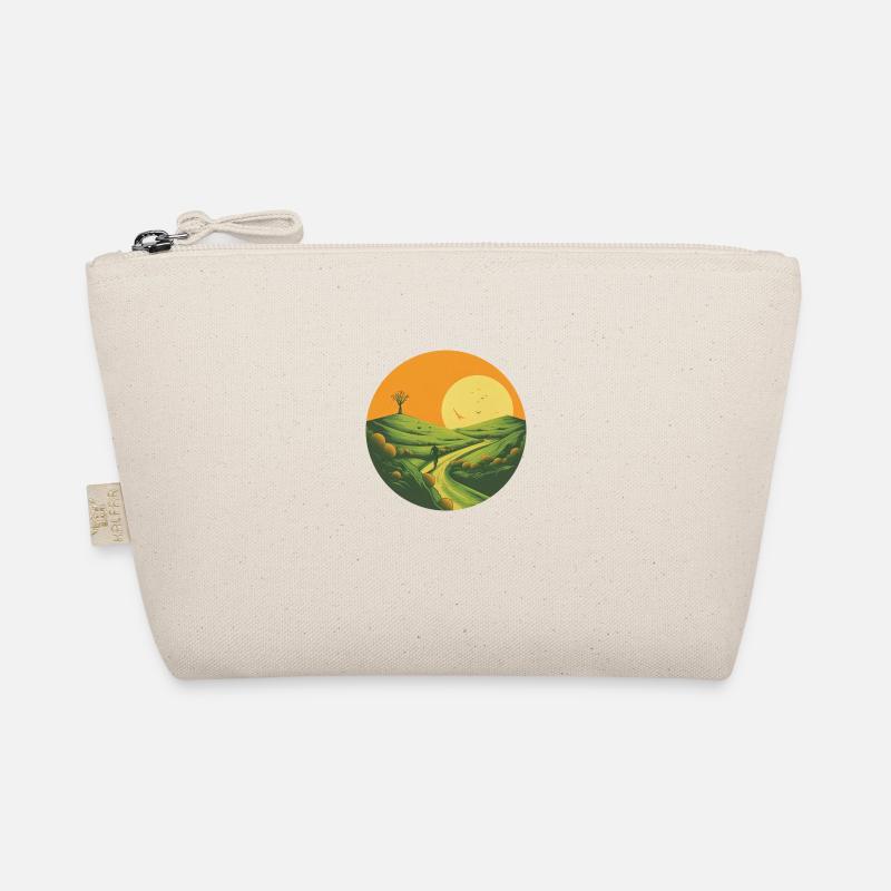 Cyclist uphill at sunset Organic Pouch