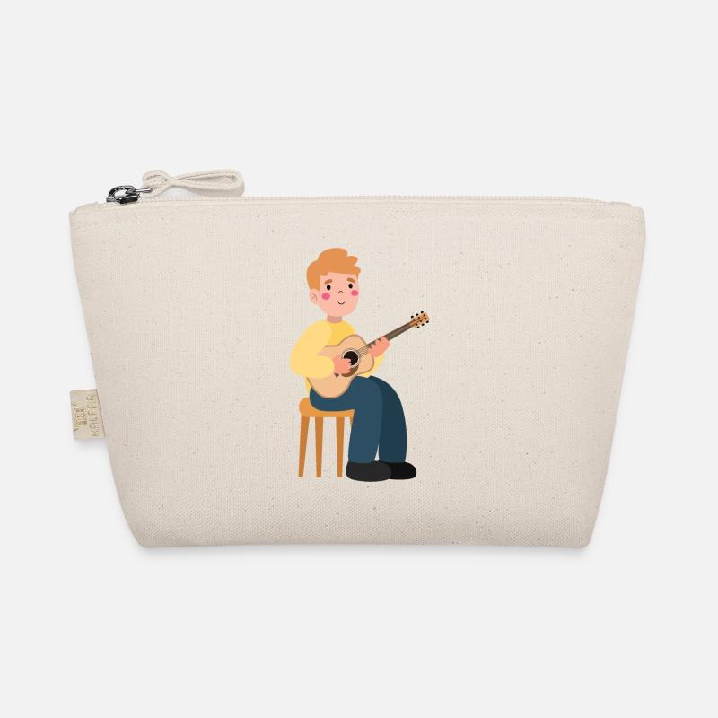 Un garçon joue de la guitare Trousse biologique