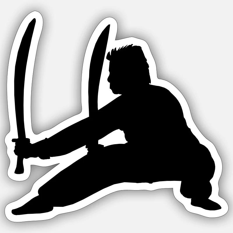 Pratiquant de Kung Fu avec deux épées Sticker taille S (10 x 10 cm)