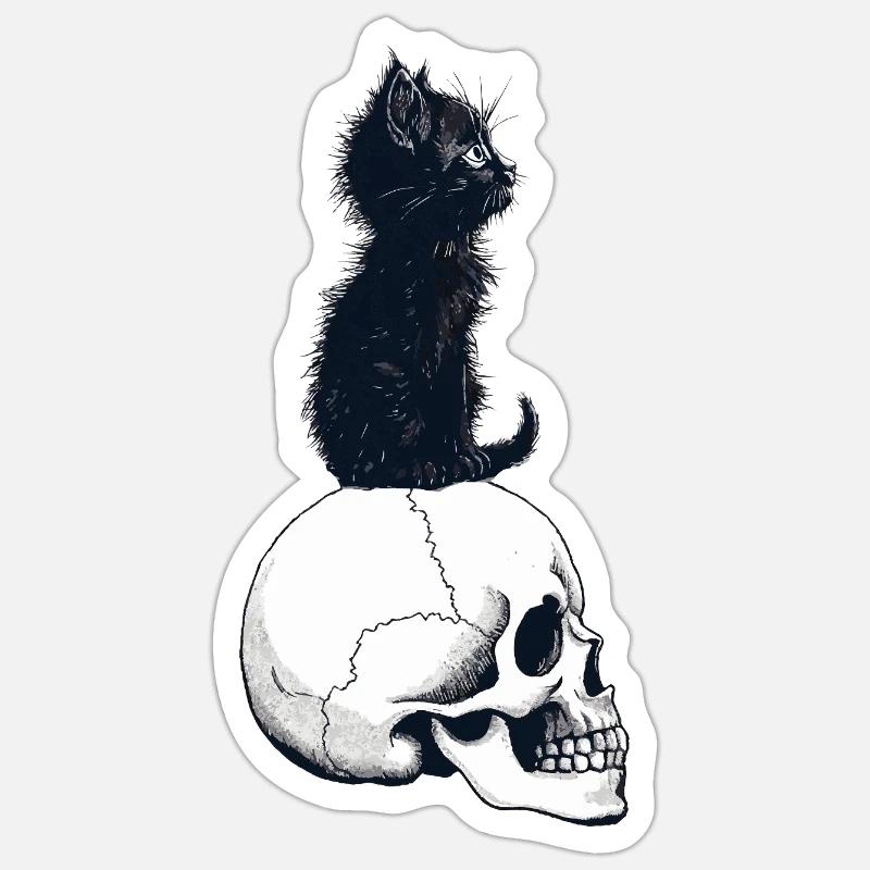 Niedliches Kätzchen sitzt auf einem Schädel - Sticker Größe S (10 x 10 cm) - Mattweiß