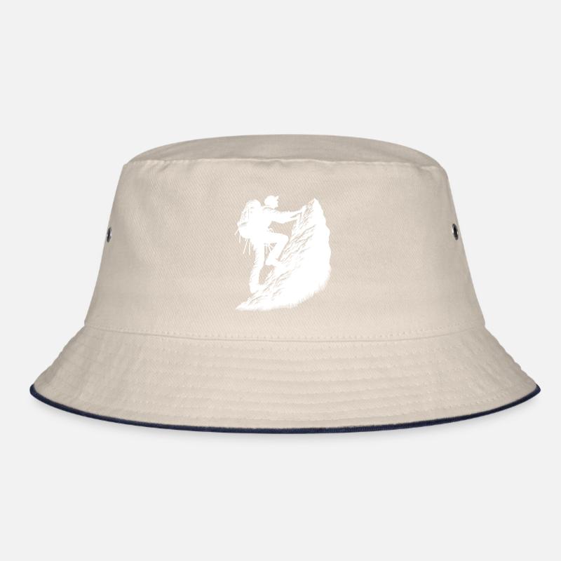 Man climbing on mountain top rocks Bucket Hat