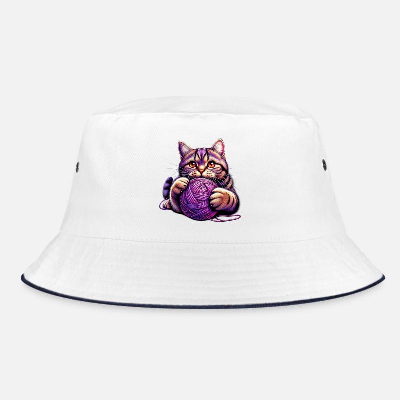 Le chat joue avec une pelote de laine Bob