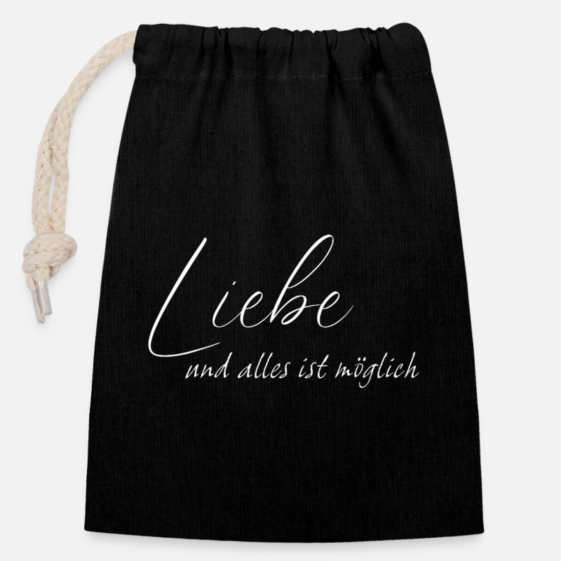 L’amour et tout est possible - Sac cadeau en coton avec cordon (14 x 20 cm) - noir