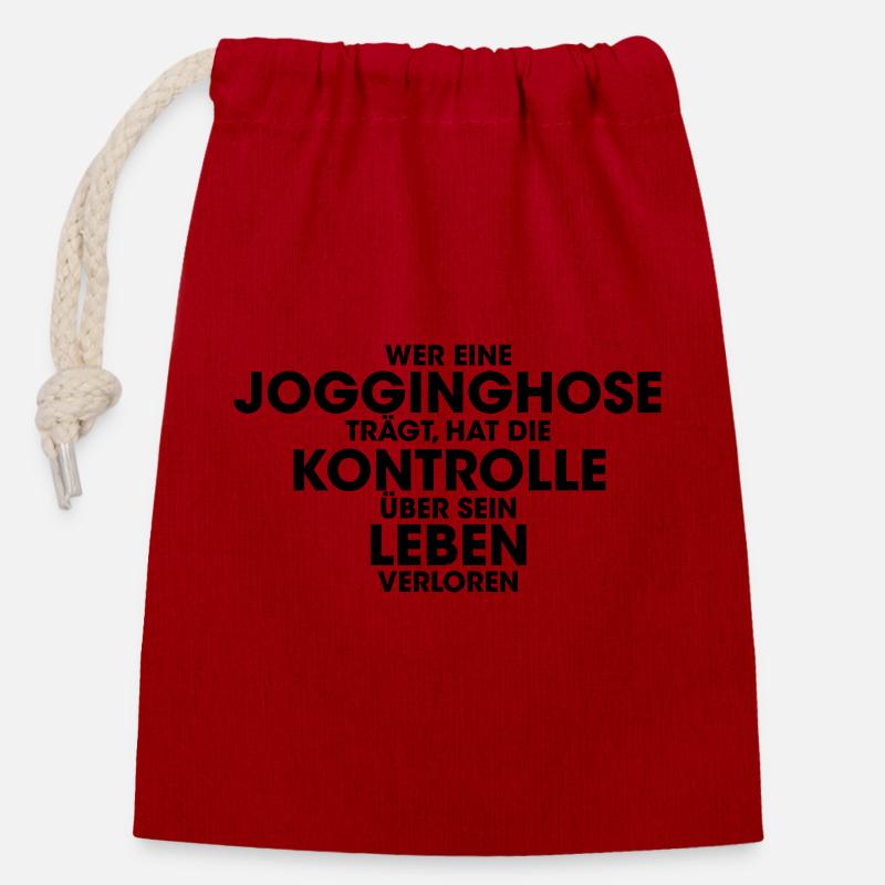 Wer eine Jogginghose trägt hat die Kontrolle über - Verschließbarer Geschenkbeutel aus Baumwolle (14x20cm) - Rot