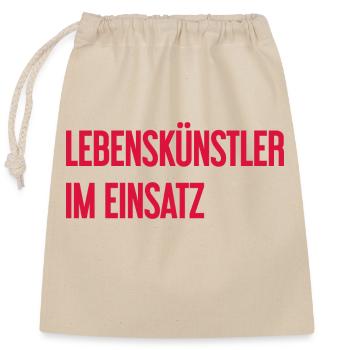 Lebenskünstler im Einsatz - Verschließbarer Geschenkbeutel aus Baumwolle (25x30cm) - Natur - Vorne
