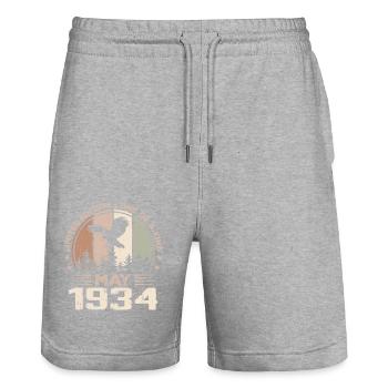 Incomparable depuis mai 1934, 90e Anniversaire - Short de jogging bio TRAINER Stanley/Stella unisexe - gris chiné - Devant - Nik (191cm) & Marisol (170cm)