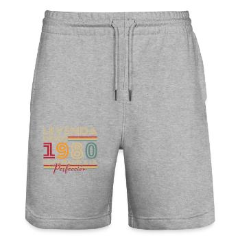 Legende seit 1980 Geburtstagsgeschenk - Stanley/Stella Unisex Bio Joggingshorts Trainer  - Grau meliert - Vorne - Nik (191cm) & Marisol (170cm)