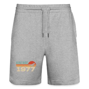 Vintage 1977 Cadeau D'anniversaire 1977 Retro 1977 - Short de jogging bio TRAINER Stanley/Stella unisexe - gris chiné - Devant - Nik (191cm) & Marisol (170cm)